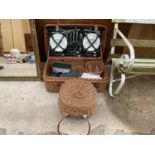 A WHICKER PICNIC HAMPER COMPLETE WITH GLASS, CERAMIC AND FLAT WARE AND A FURTHER WHICKER BASKET