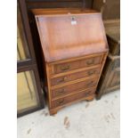 A YEW WOOD BUREAU WITH FALL FRONT AND FOUR DRAWERS