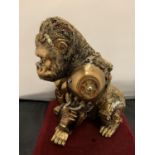 A GOLD COLOURED STEAMPUNK GORILLA