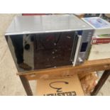 A LARGE SILVER KENWOOD MICROWAVE OVEN BELIEVED IN WORKING ORDER BUT NO WARRANTY