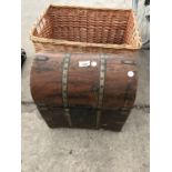 A WICKER LOG BASKET AND A DECORATIVE MINIATURE STORAGE CHEST