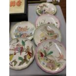 AN ASSORTMENT OF DECORATIVE CERAMIC PLATES DEPICTING ELVES