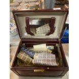 A JEWELLERY BOX WITH MIRROR INSERT CONTAINING A QUANTITY OF STAMPS