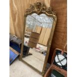 A LARGE GILT EDGE FRAMED WALL MIRROR WITH FLORAL DETAIL (H:145CM W:75CM)(A/F)