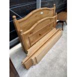 A PINE KING SIZE BEDSTEAD