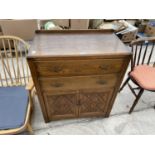 AN EARLY 20TH CENTURY OAK TALLBOY