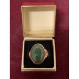 A 22 CARAT GOLD RING WITH A LARGE JADE IN FINE CONDITION 5.2G SIZE:O