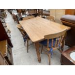 A MODERN PINE DINING TABLE AND FOUR CHAIRS