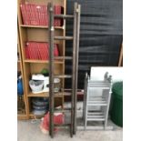 A SET OF WOODEN EXTENDABLE LADDERS