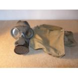 A WORLD WAR II GAS MASK AND BAG