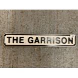 A WOODEN 'THE GARRISON' STREET STYLE SIGN