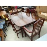 A G-PLAN EXTENDING DINING TABLE AND SIX CHAIRS