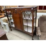 AN EARLY 20TH CENTURY MAHOGANY GLAZED DISPLAY CABINET WITH PANELLED CENTRE SECTION, ON BALL AND CLAW