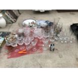 A LARGE ASSORTMENT OF GLASS WARE TO INCLUDE WINE GLASSES AND DISHES ETC