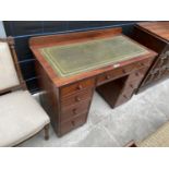 A VICTORIAN MAHOGANY KNEE HOLE DESK WITH NINE DRAWERS AND GREEN LEATHER WRITING SURFACE - 43" WIDE
