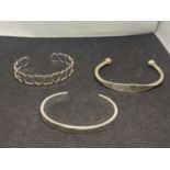 THREE SILVER BANGLES TO INCLUDE A HEART BANGLE, LOVE YOU BANGLE AND AN IDENTITY STYLE ALL MARKED 925