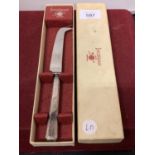 A BOXED SILVER PLATED CHEESE KNIFE