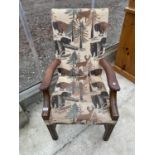 A 19TH CENTURY STYLE BEECH FRAMED OPEN ARMCHAIR WITH WILD BEAR AND DEER DECORATED UPHOLSTERY