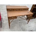 A BAMBOO FRAMED WRITING DESK WITH SIX DRAWERS - 45" WIDE
