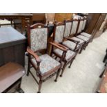 A SET OF SIX JACOBEAN STYLE DIING CHAIRS, TWO BEING CARVERS, WITH PAISLEY STYLE UPHOLSTERY