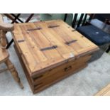 A MEXICAN PINE STORAGE CHEST WITH METEAL STRAPS