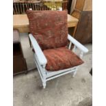 A PAINTED MID 20TH CENTURY RECLINING CHAIR