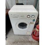 A WHITE ZANUSSI WASHING MACHINE BELIEVED IN WORKING ORDER BUT NO WARRANTY