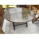 A 19TH CENTURY MAHOGANY CAMPAIGN STYLE FOLD-OVER TABLE ON TURNED LEGS