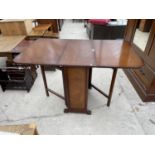A 1950s MAHOGANY DROP LEAF DINING TABLE