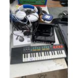 AN ASSORTMENT OF ELECTRICALS TO INCLUDE A SMALL KEYBOARD, HEADPHONES AND A CD PLAYER ETC