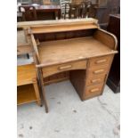 A SMALL PINE SINGLE PEDESTAL DESK WITH FIVE DRAWERS