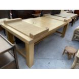 A MODERN OAK EXTENDING DINING TABLE ON SQUARE LEGS AND STRETCHERS, 87x33" (TWO LEAVES EACH 17.5")