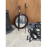 AN OVAL BEVELED EDGE MIRROR AND TWO FURTHER SWORDS
