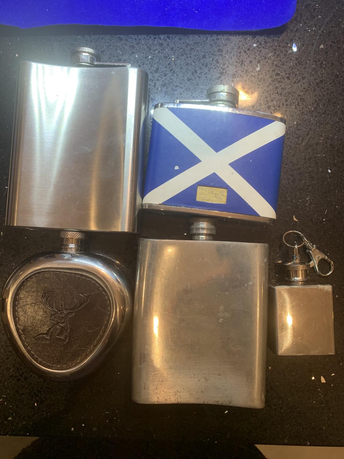 FIVE VARIOUS HIP FLASKS TO INCLUDE A STAG AND SCOTLAND ETC