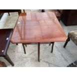 AN EDWARDIAN MAHOGANY AND INLAID SUTHERLAND TABLE