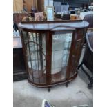 A SHINY WALNUT DISPLAY CABINET