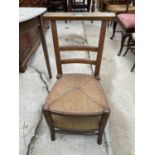 AN UNUSUAL ELM CHAPEL STYLE CHAIR WITH RUSH UPPER SEAT WHICH TILTS TO REVEAL UPHOLSTERED LOWER