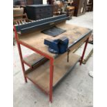 A METAL FRAMED WOODEN WORK BENCH WITH A RECORD VICE