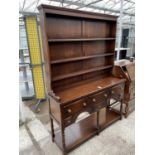 A GEORGIAN STYLE OAK DRESSER ENCLOSING SIX DRAWERS, POT BOARD AND PLATE RACK, 54" WIDE