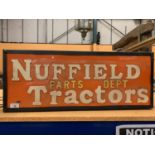 AN ILLUMINATED 'NUFFIELD PARTS DEPT TRACTORS' SIGN