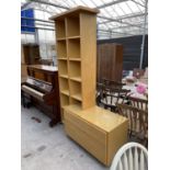 A LIGHT OAK CHEST OF TWO DRAWERS WITH TEN OPEN DISPLAY SHELVES ABOVE