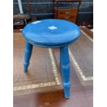 A SMALL BLUE PAINTED THREE LEG STOOL