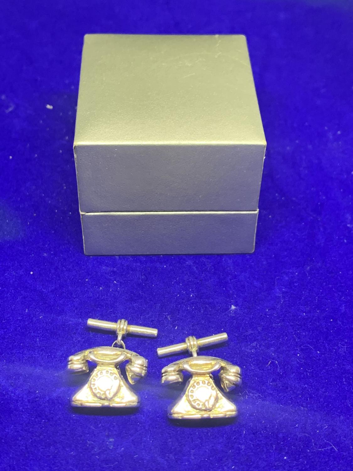 A PAIR OF HALLMARKED SILVER TELEPHONE STYLE CUFF LINKS IN A PRESENTATION BOX