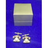 A PAIR OF HALLMARKED SILVER TELEPHONE STYLE CUFF LINKS IN A PRESENTATION BOX
