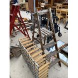 A SET OF VINTAGE WOODEN STEP LADDERS AND A WINE RACK