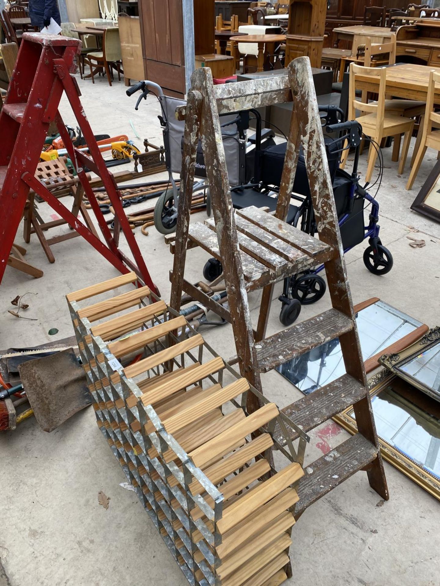 A SET OF VINTAGE WOODEN STEP LADDERS AND A WINE RACK