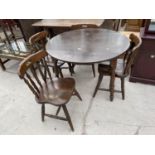 A CIRCULAR OAK DROP LEAF DINING TABLE AND FOUR DINING CHAIRS