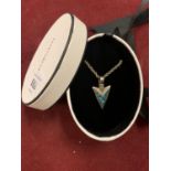 A BOXED SILVER NECKLACE WITH NAVAJO ARROWHEAD STYLE PENDANT BOTH MARKED 925