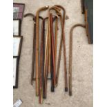 AN ASSORTMENT OF WOODEN WALKING STICKS