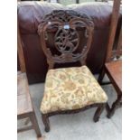 A VICTORIAN STYLE HARDWOOD DINING CHAIR WITH PIERCED FOLIATE BACK DEPICTING WILD DOG